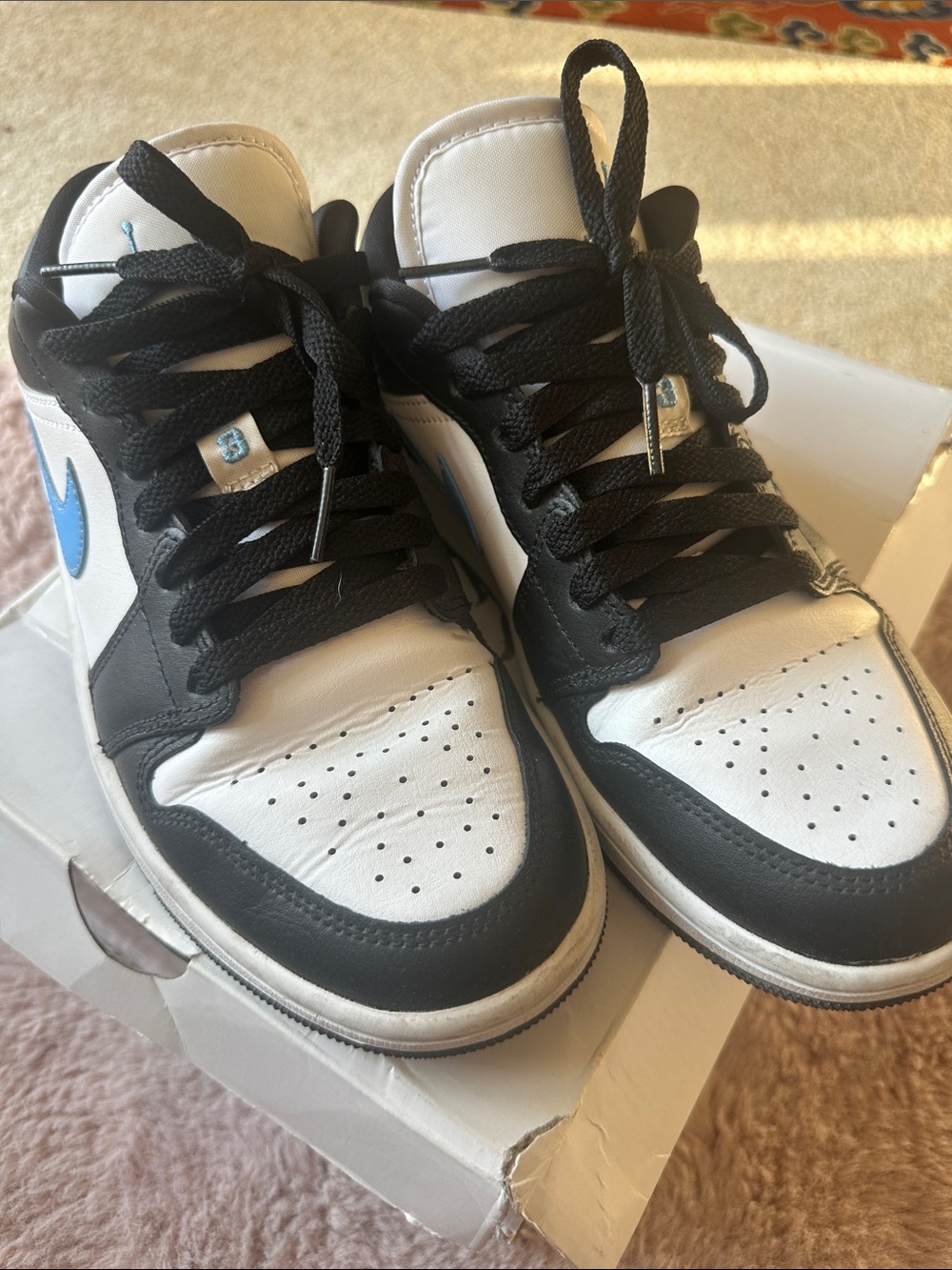 Nike Kids Black and White High-Top Sneakers with Blue Swoosh